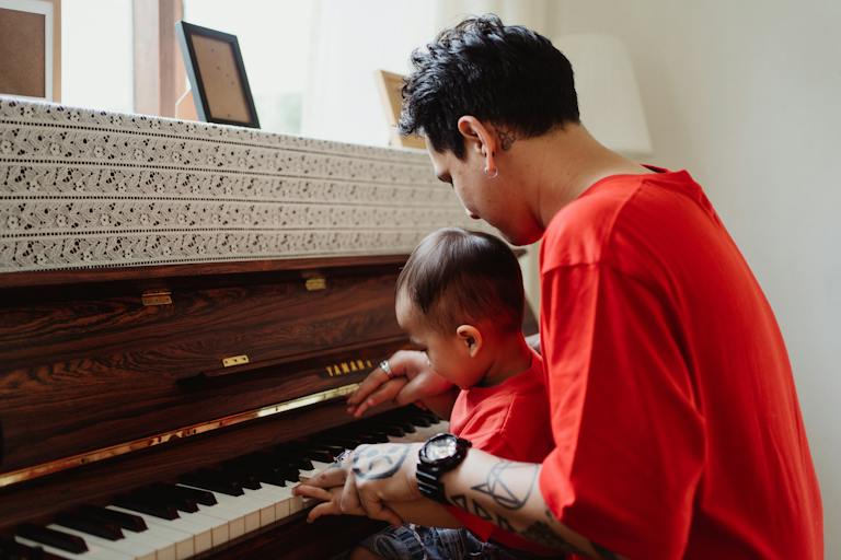 Father Teaching his Son to Play the Piano